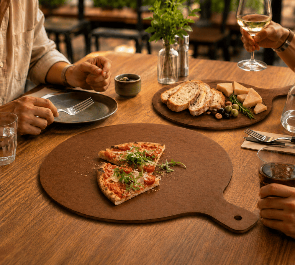 Remica wood fiber pizza board for slicing serving and sharing